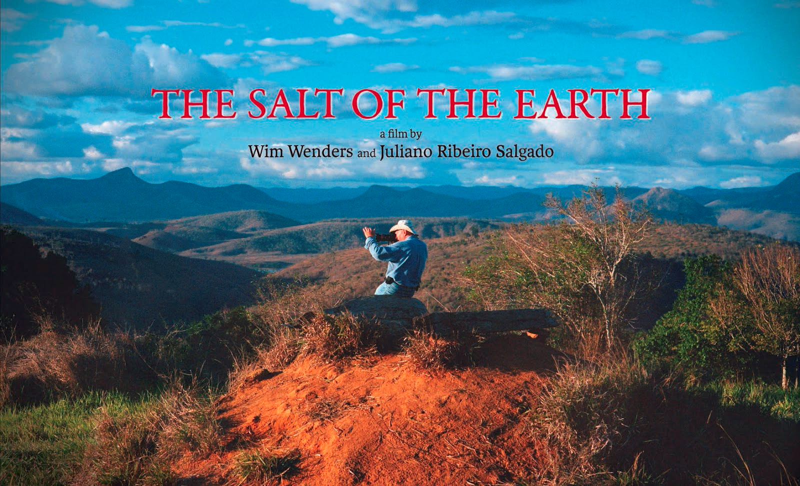 Salt of the earth poster, photographer sitting in landscape